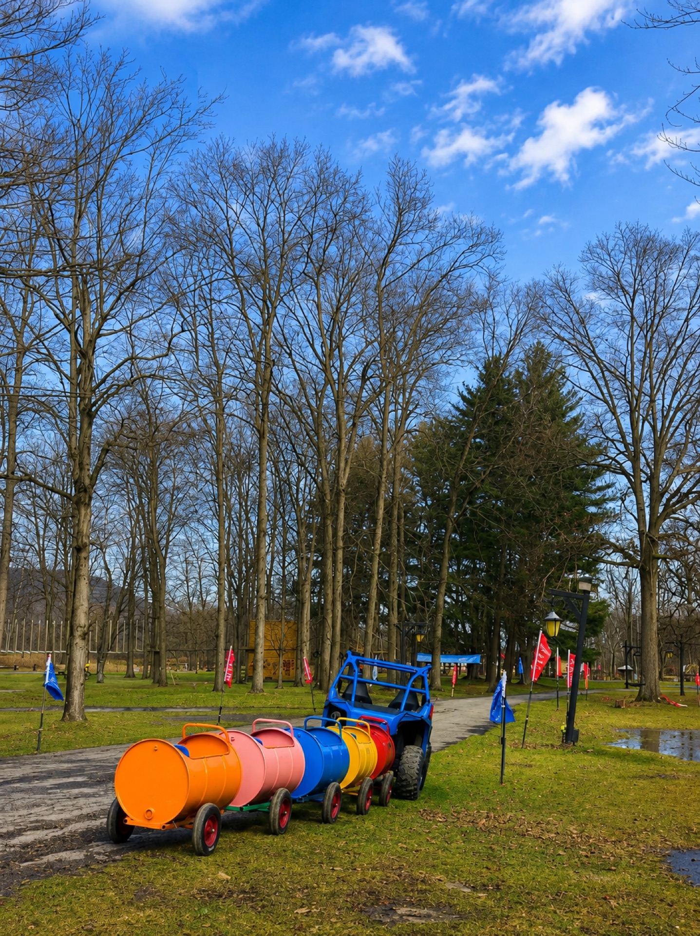 Colorful kids barrel train ride at 9 Lake Resort playground